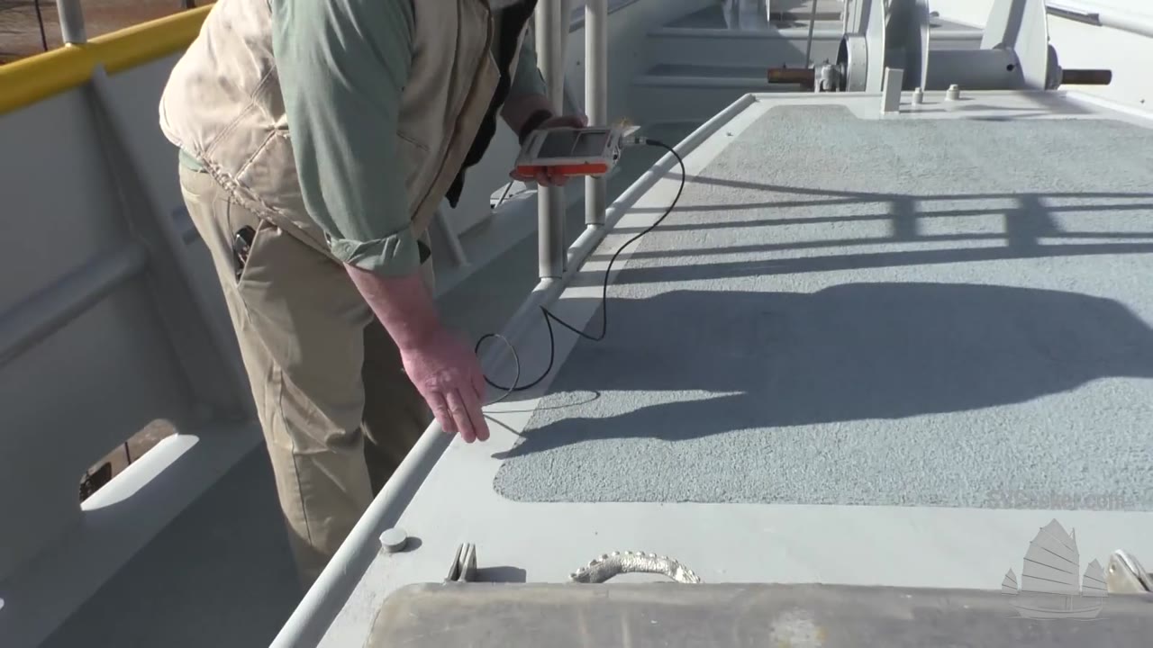 200130 Industrial Coatings - Inspector with Dry Film Meter watermarked